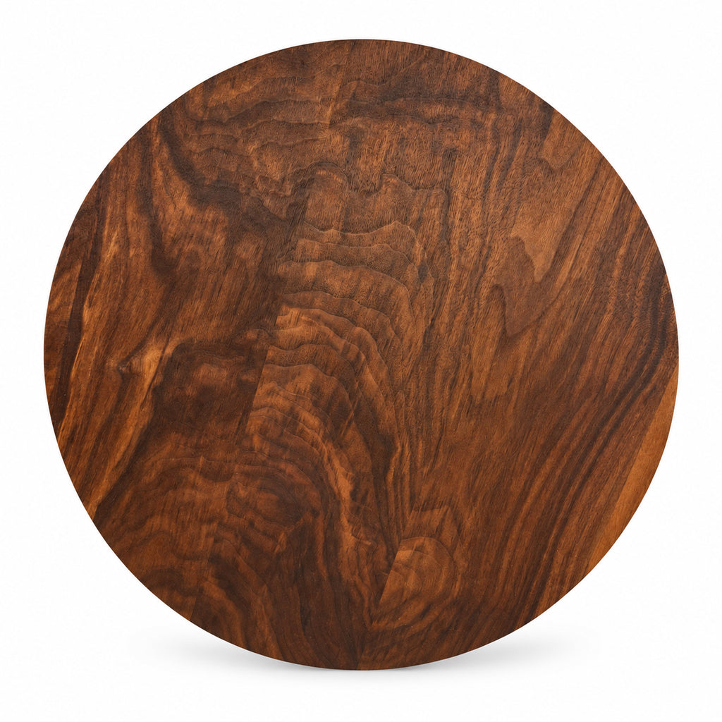 A round wooden serving board with a rich dark brown Walnut wood grain pattern